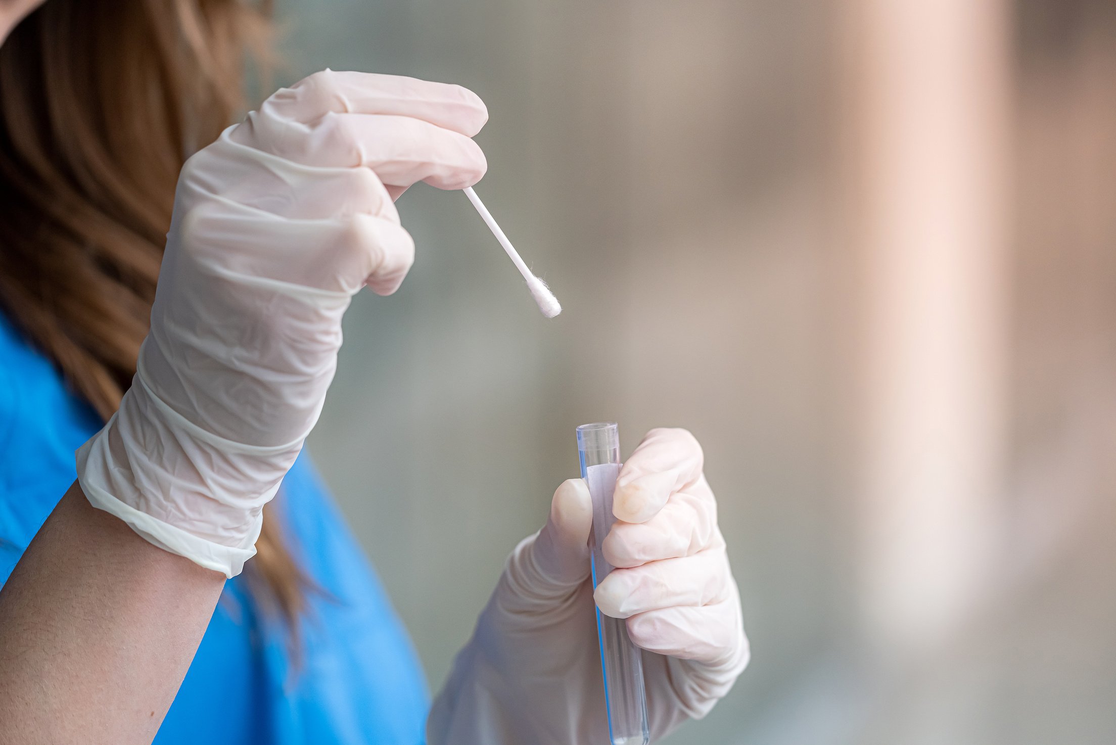 nurse holding nasal swab laboratory test for Coronavirus or COVID-19